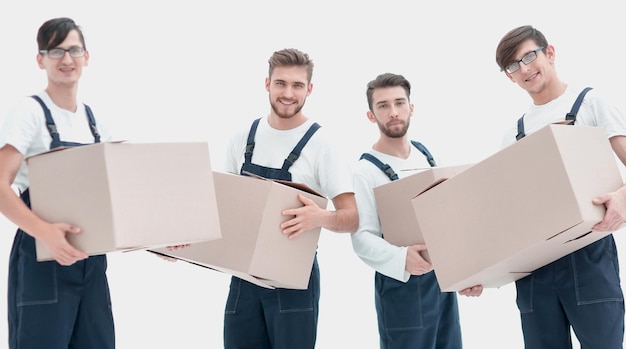 Photo workers holding boxes when moving flats