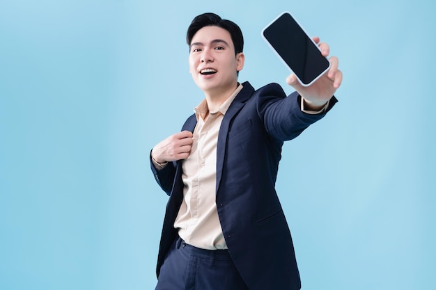 Photo of young Asian businessman on background