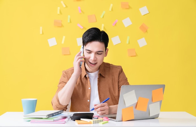 Photo of young Asian businessman working on background