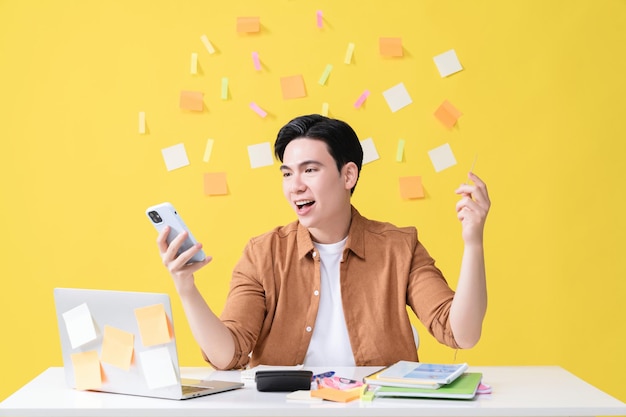 Photo of young Asian businessman working on background