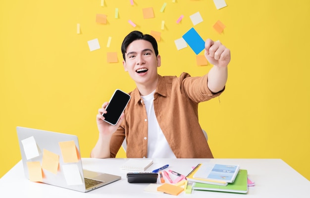 Photo of young Asian businessman working on background