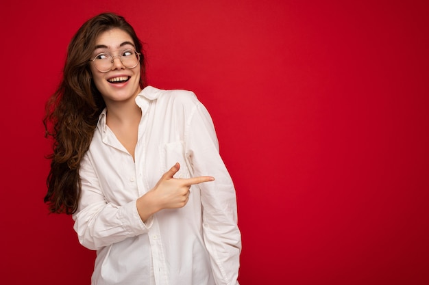 Photo of young beautiful happy smiling brunette woman wearing white shirt and optical glasses sexy