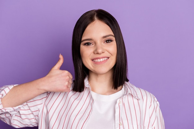 Photo of young cheeful lady show thumbup feedback suggest perfect ads isolated over violet color background