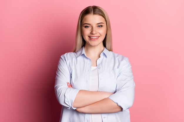 Photo of young cheerful girl folded hands agent banker representative isolated over pink color background