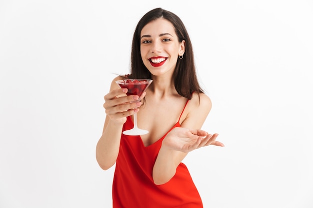 Photo of young happy excited woman posing isolated drinking cocktail.