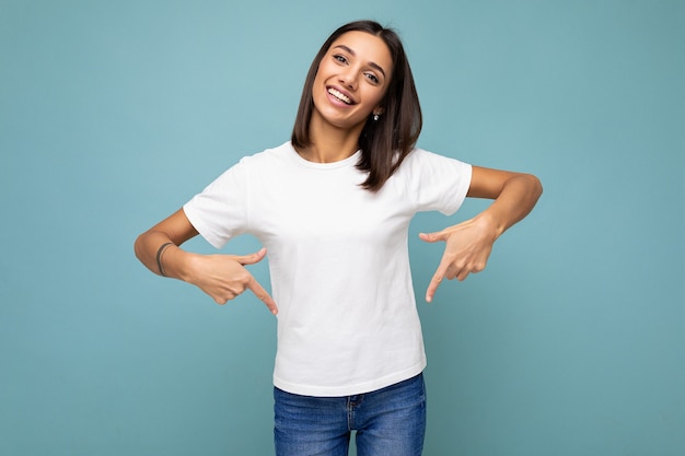 Photo of young positive happy smiling beautiful woman with sincere emotions wearing stylish clothes