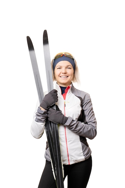 Photo of young sportswoman with skis on empty white background