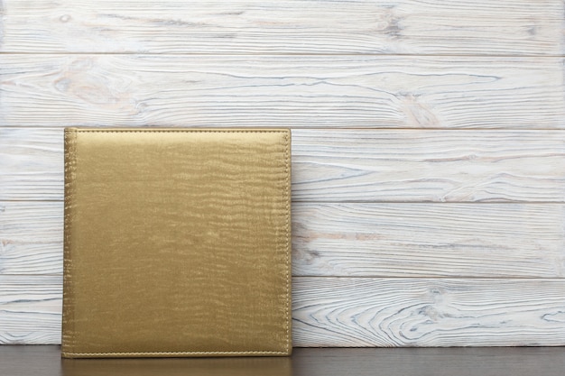 Photoalbum with golden fabric cover