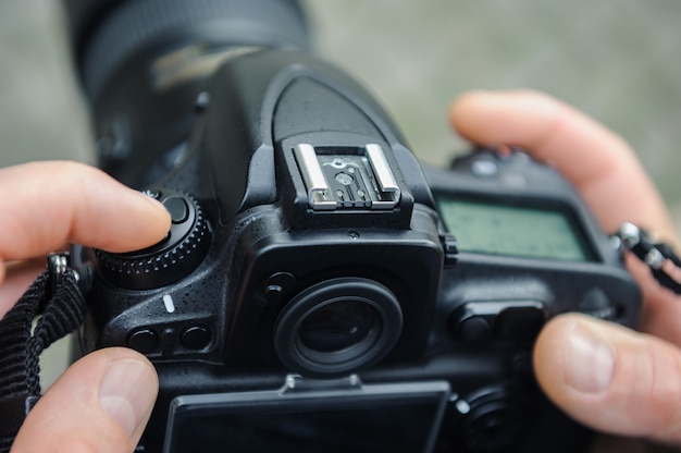 A photographer adjusts the camera.