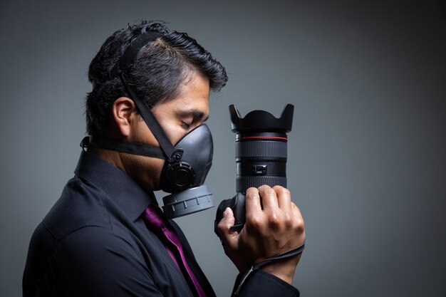 Photographer closing his eyes pandemic mask protecting himself from the coronavirus