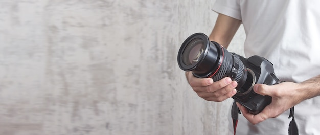 Photographer holding camera and lens Concept for photographing