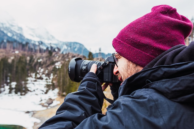 Photographer is taking photos in Alps