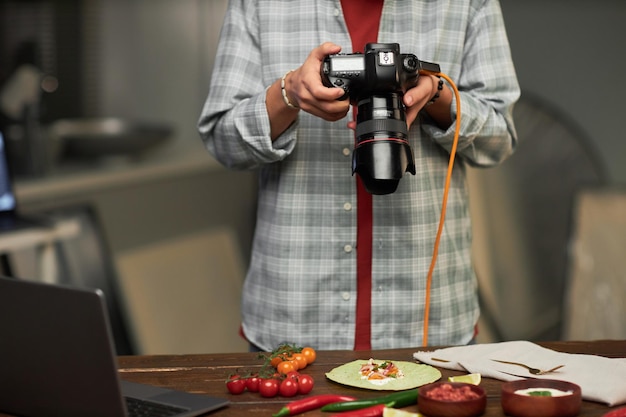 Photo photographer making photo of food on digital camera