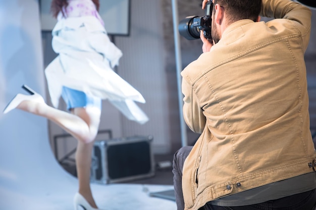 Photographer and model in studio