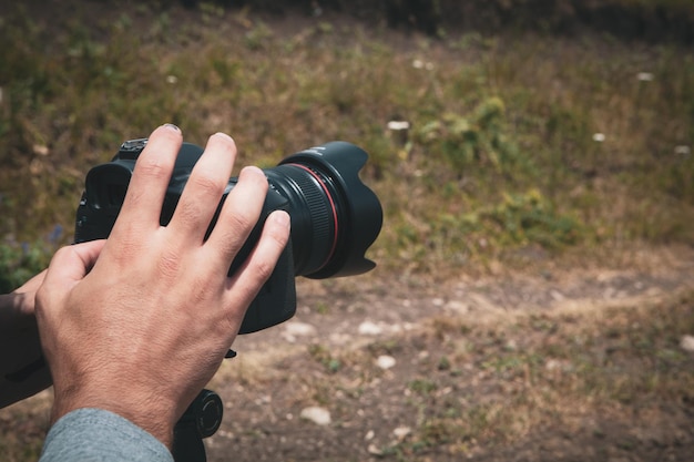 The photographer on the mountain takes a photo