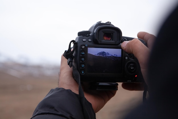 The photographer photographs the sunset in the evening