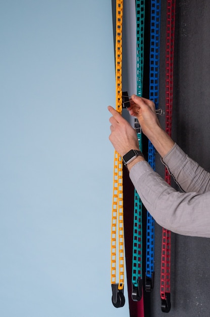 Photographer prepares for shooting in a photo studio.Man changing paper background in a photo studio