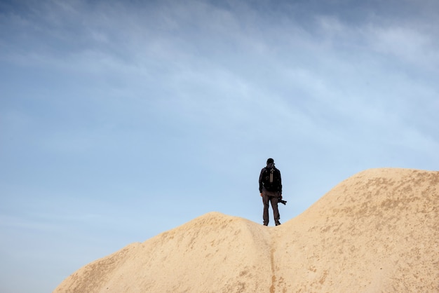 Photographer sandstone cliff and observing the natural landscape