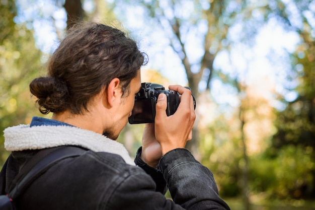 Photographer shooting pictures outdoors in the park