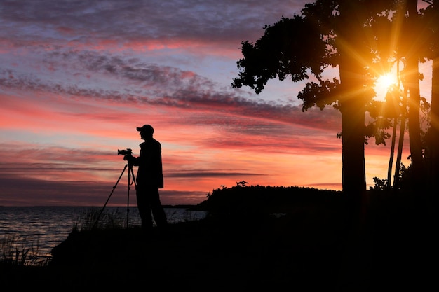 Photographer silhouette at sunset