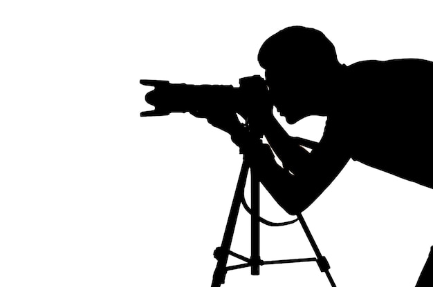 Photographer at work. Side view silhouette of man using tripod while shooting and standing isolated on white