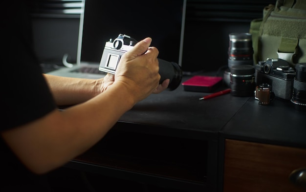 Photographer working checking camera Stylish home studio concept of hipster Seleted focus