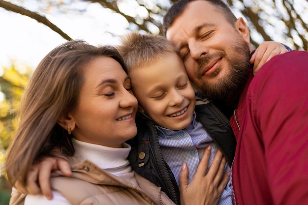 Photographs of a happy traditional family closeup portrait of mom dad and baby boy