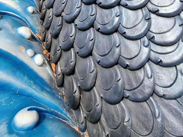 A photography of a blue and black sculpture of a fish