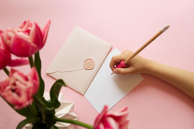 Photography of above of childs handwriting on blank card of certificate gift