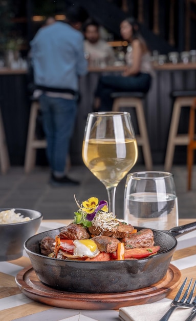 photography of a gourmet food plate on a restaurant table By Yuri Ugarte Cespedes