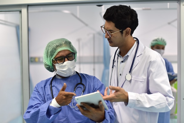 Photos of doctors in work uniforms Doctor consulted about the patient's case in the emergency room 