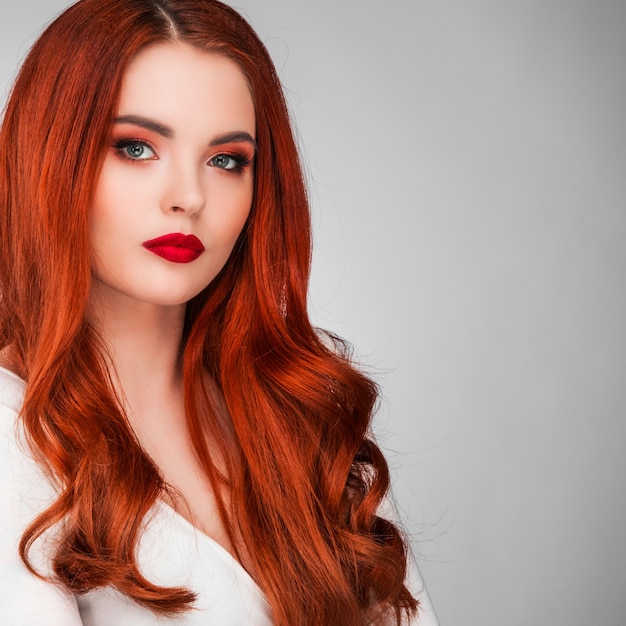 Photoshot of gorgeous redhead girl with bright makeup