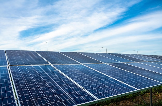 Photovoltaic solar power panel on dramatic sunset blue sky background green clean Alternative power energy concept