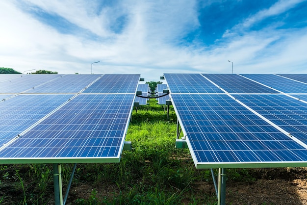 Photovoltaic solar power panel on dramatic sunset blue sky background green clean Alternative power energy concept