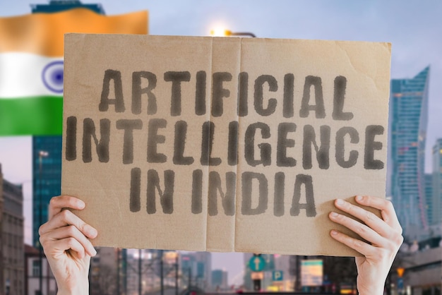 The phrase Artificial Intelligence in India is on a banner in men's hands with blurred background Service Computer Digital Artificial Intelligence Automated Automation Control Engineer