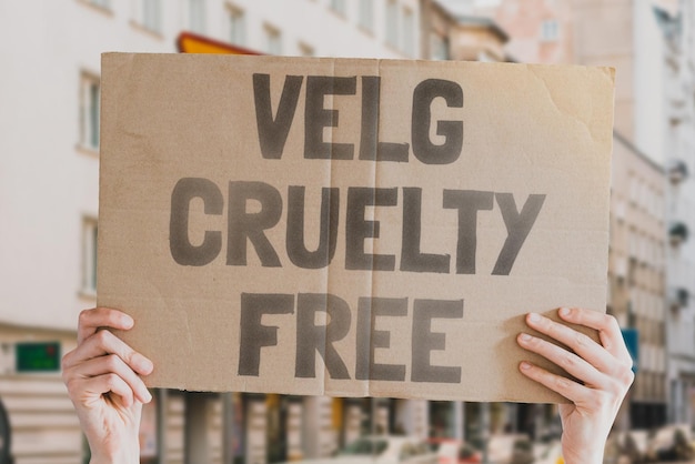 The phrase Choose cruelty free is on a banner in men's hands Animal rights protest Protection City Urban Rally Freedom Stop animal testing Equality Justice Care Life Humanity