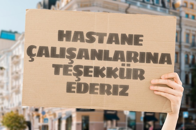 The phrase Thank you hospital workers on a banner in hand The Human holds cardboard with an inscription Gratitude to healthcare staff Heroes People who save lives Thankfulness Life