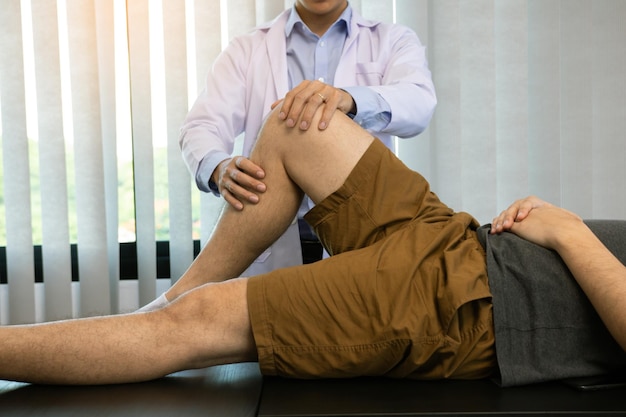 Physical therapists are using the handle to the patient knee to check for pain