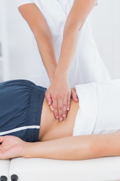 Physiotherapist doing back massage 