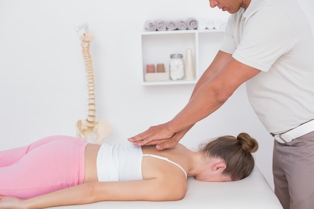 Physiotherapist doing back massage 