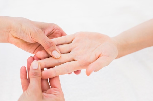  Physiotherapist doing hand massage