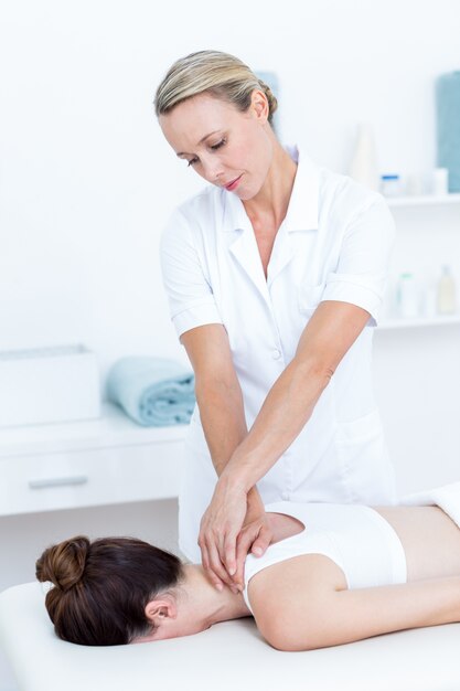 Physiotherapist doing shoulder massage 