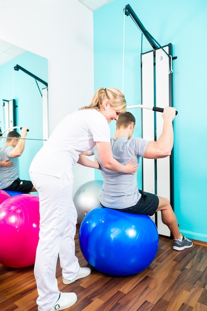 Physiotherapist doing sport rehabilitation with patient