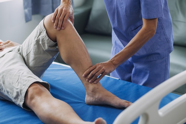 Physiotherapist working with patient in clinic closeup