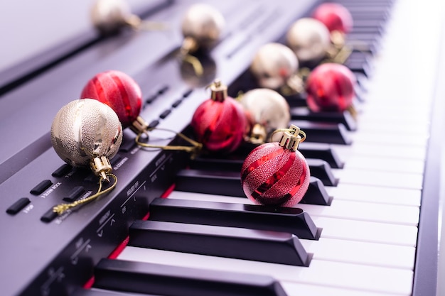 Piano keyboard with Christmas garland close up