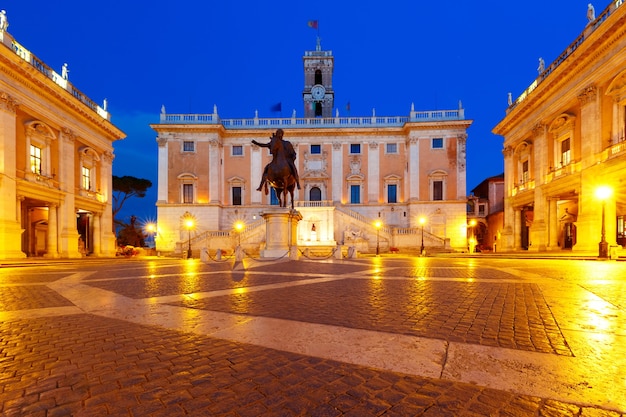 Piazza del Campidoglio on the top of Capitoline Hill with the facade of Senatorial Palace and equestrian statue of Marcus Aurelius at night, Rome, Italy