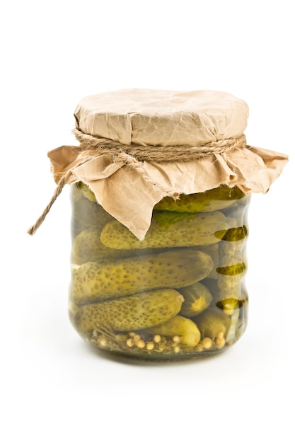 Pickled cucumbers in glass jar isolated on white background