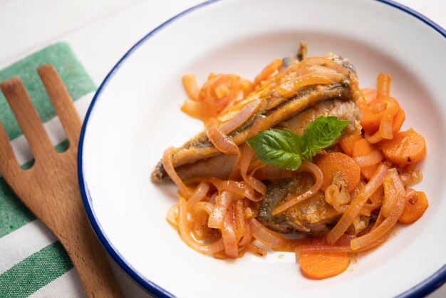 Pickled horse mackerel with carrot and onion.