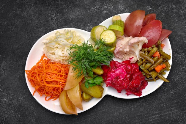 Pickled vegetables with dill on a plate