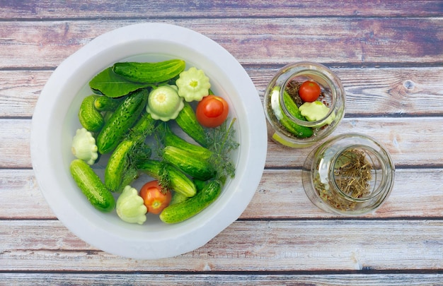 Pickling freshly picked cucumbers and tomatoes